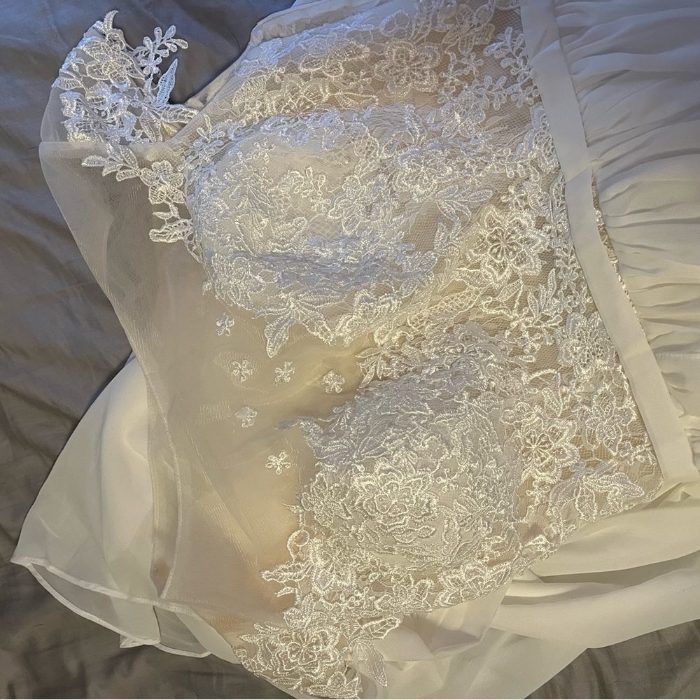 I am selling this beautiful dress because it did not fit me.